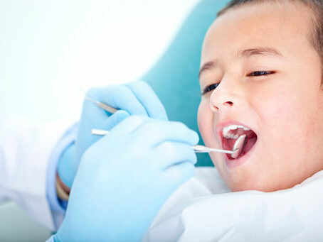 kid at dental exam